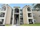 The exterior shows stairs and multiple balconies to the condos in the building at 4728 Walden Cir # 32, Orlando, FL 32811
