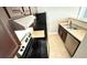 A kitchen featuring stainless steel appliances, light countertops, and dark cabinets at 4728 Walden Cir # 32, Orlando, FL 32811