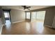 Living area with tile flooring, a ceiling fan, and natural light streaming through the windows at 4728 Walden Cir # 32, Orlando, FL 32811