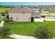 Aerial view of a spacious backyard with a well-maintained lawn and partial fencing at 4800 Riverwalk Dr, St Cloud, FL 34771