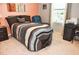 Bedroom featuring neutral carpet, large window and comfortable seating at 4800 Riverwalk Dr, St Cloud, FL 34771