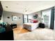 Spacious main bedroom featuring plush carpet, ceiling fan and dual windows at 4800 Riverwalk Dr, St Cloud, FL 34771