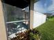 Enjoy the view from this screened-in patio with comfortable seating at 4800 Riverwalk Dr, St Cloud, FL 34771