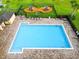 From above, the pool and playground offer a fun oasis with lounge chairs at 4800 Riverwalk Dr, St Cloud, FL 34771
