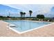 A refreshing community pool with lounge chairs and a brick surround awaits your enjoyment at 4800 Riverwalk Dr, St Cloud, FL 34771