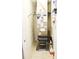 Utility closet featuring the homes air conditioning unit, filter and shelving at 4800 Riverwalk Dr, St Cloud, FL 34771