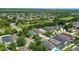 An aerial view shows a neighborhood with lush trees and manicured lawns highlighting the house with a new roof at 4903 Santa Clara Dr, Orlando, FL 32837