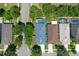 A high angle shot of the home set in a neighborhood, with a screened pool at 4903 Santa Clara Dr, Orlando, FL 32837