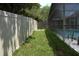 Fenced backyard with grass near the pool and new privacy fence at 4903 Santa Clara Dr, Orlando, FL 32837
