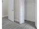 Bedroom closet with shelving unit, white trim, and laminate floors at 4903 Santa Clara Dr, Orlando, FL 32837