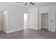 Spacious bedroom with hard floors, ceiling fan, and dual closets at 4903 Santa Clara Dr, Orlando, FL 32837