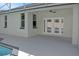 Rear exterior of home featuring a large patio area and double French doors at 4903 Santa Clara Dr, Orlando, FL 32837