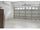 Spacious two car garage with white walls and ceiling and an insulated door at 4903 Santa Clara Dr, Orlando, FL 32837