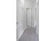 Hallway with gray vinyl floors, doors, and white trim at 4903 Santa Clara Dr, Orlando, FL 32837