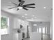 Open-concept kitchen with white cabinets, stainless steel appliances, and pendant lighting at 4903 Santa Clara Dr, Orlando, FL 32837