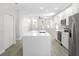 Open-concept kitchen with stainless steel appliances, a large island, and modern finishes at 4903 Santa Clara Dr, Orlando, FL 32837
