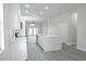 Modern kitchen with white cabinets, stainless steel appliances, and island with sink at 4903 Santa Clara Dr, Orlando, FL 32837