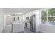 Bright, open kitchen featuring stainless steel appliances, a large island, and modern finishes at 4903 Santa Clara Dr, Orlando, FL 32837