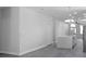 Open concept with a kitchen island, lighting, and light colored walls at 4903 Santa Clara Dr, Orlando, FL 32837