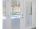 White French doors offer a pool view from the patio at 4903 Santa Clara Dr, Orlando, FL 32837