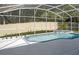 Sparkling screened-in pool and spa surrounded by a spacious pool deck and landscaped yard at 4903 Santa Clara Dr, Orlando, FL 32837