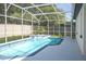 Beautiful screened pool and spa with surrounding white deck and fenced yard at 4903 Santa Clara Dr, Orlando, FL 32837