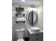 Bathroom featuring a vessel sink, decorative shelves, and modern lighting fixture at 5826 Peregrine Ave # F01, Orlando, FL 32819