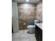 Tiled bathroom featuring a toilet, vanity, and storage closet for a clean and functional space at 5826 Peregrine Ave # F01, Orlando, FL 32819