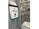 Bathroom featuring a glass shower door, decorative tiles and towel rack at 5826 Peregrine Ave # F01, Orlando, FL 32819