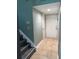 Inviting entryway with tiled flooring, stairway, and a white door, offering a glimpse into the home at 5826 Peregrine Ave # F01, Orlando, FL 32819