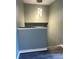 View of the hallway with a modern pendant light fixture and gray-painted walls at 5826 Peregrine Ave # F01, Orlando, FL 32819