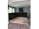 Spacious living room featuring a large sectional couch, plush rug, and light-colored walls for a calming ambiance at 5826 Peregrine Ave # F01, Orlando, FL 32819