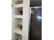 Shower niche with open storage for decor and amenities, with a glass shower door to the right at 5826 Peregrine Ave # F01, Orlando, FL 32819