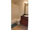 Bathroom featuring a vanity with dark wood cabinets, a black countertop and a shower with a white curtain at 6148 Westgate Dr # 302, Orlando, FL 32835