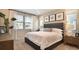 Well-lit bedroom with large windows, neutral decor, and elegant furnishings at 746 Lake Dell Ave, Dundee, FL 33838