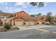 Street view of townhomes with terra cotta colored walls and tile roofs at 7667 Sugar Bend Dr # 7667, Orlando, FL 32819