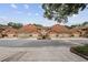 Street view of coordinated townhomes each featuring two car garages and tile roofs at 7667 Sugar Bend Dr # 7667, Orlando, FL 32819