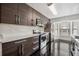 Stylish kitchen featuring sleek cabinetry, stainless steel appliances, and quartz countertops at 7667 Sugar Bend Dr # 7667, Orlando, FL 32819