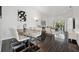 Open-concept living and dining area with modern furniture and hardwood floors at 7667 Sugar Bend Dr # 7667, Orlando, FL 32819