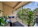 The screened in patio has great views of landscaping and is furnished for relaxing or grilling at 7667 Sugar Bend Dr # 7667, Orlando, FL 32819