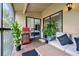 The screened in patio has great views of landscaping and is furnished for relaxing or grilling at 7667 Sugar Bend Dr # 7667, Orlando, FL 32819
