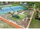 Overhead view of the community playground, showcasing colorful play equipment and -safe ground cover at 7667 Sugar Bend Dr # 7667, Orlando, FL 32819