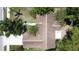 Aerial rooftop view of a well-maintained home, showcasing the roof's condition and surrounding landscaping at 86 Blackberry Creek Dr, St Cloud, FL 34769