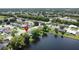 An aerial view shows the home's location in a community with lake access and mature trees at 86 Blackberry Creek Dr, St Cloud, FL 34769