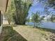Backyard with lush bamboo along the waterfront creates a serene and private outdoor space at 86 Blackberry Creek Dr, St Cloud, FL 34769