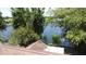 Roof top view of a property with a serene lake view and lush trees, perfect for nature lovers at 86 Blackberry Creek Dr, St Cloud, FL 34769