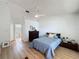 Well-lit bedroom featuring vaulted ceilings and an en suite bathroom entrance at 86 Blackberry Creek Dr, St Cloud, FL 34769