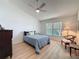 Bedroom with neutral walls, ceiling fan, and window letting in natural light at 86 Blackberry Creek Dr, St Cloud, FL 34769