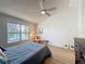 Bedroom featuring a window view of a body of water, vaulted ceilings and ceiling fan at 86 Blackberry Creek Dr, St Cloud, FL 34769