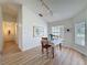 Bright dining room with wood floors, natural light, and space for entertaining at 86 Blackberry Creek Dr, St Cloud, FL 34769